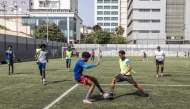(Files) Football students play a game during practice at the Bola Pra Frente (Ball Forward) football academy in Praia, on May 18, 2026. (Photo by Patrick Meinhardt / AFP)