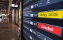 A departures board shows a cancelled flight to Okinawa after Severe Tropical Storm Jangmi shut down the airport at Haneda Airport in Tokyo on June 1, 2026. (Photo by Andrew Caballero-Reynolds / AFP)