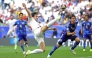(FILES) Iran's forward #20 Sardar Azmoun shoots the ball past Japan's defender #22 Takehiro Tomiyasu during the Qatar 2023 AFC Asian Cup quarter-final football match between Iran and Japan at Education City Stadium in al-Rayyan, west of Doha, on February 3, 2024. (Photo by Giuseppe Cacace / AFP)