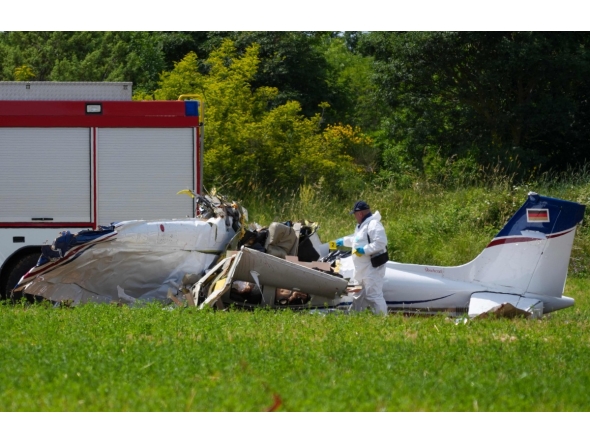 A police officer in protective gear collects evidences at site of a small plane crash, which killed 4 people, in Medulin on Croatia's northern Adriatic coast, on June 4, 2026. Photo by AFP