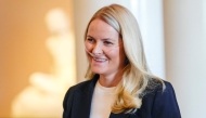 Crown Princess Mette-Marit of Norway smiles as she arrives for a reception of the Norwegian athletes who took part in the Paralympics in Milano Cortina 2026, at the Royal Palace in Oslo, Norway, on April 10, 2026. Photo by Lise إserud / NTB / AFP