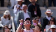 Russia's Mirra Andreeva celebrates after winning her women's final singles match against Poland's Maja Chwalinska on day 14 of the French Open tennis tournament on Court Philippe-Chatrier at the Roland-Garros Complex in Paris on June 6, 2026. (Photo by Thomas Samson / AFP)
 