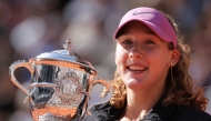 Russia's Mirra Andreeva holds the trophy after winning the French Open tennis tournament women's singles final match against Poland's Maja Chwalinska on day 14 of the French Open tennis tournament on Court Philippe-Chatrier at the Roland-Garros Complex in Paris on June 6, 2026. (Photo by Thomas Samson / AFP)
 