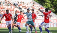 Portugal's Cristiano Ronaldo (centre) controls the ball.