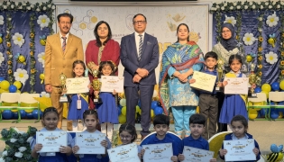 Principal PISQ Ch. Muhammad Afzal with officials and students during the event.