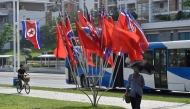 The national flags of North Korea and China are displayed on a street in Pyongyang on June 8, 2026 (Photo by Kim Won Jin / AFP)