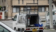 A truck with an animal cage is pictured during the search for a wild bear in Utsunomiya, north of Tokyo, on June 9, 2026. Photo by Yuichi YAMAZAKI / AFP