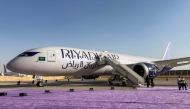 A Boeing 787-9 Dreamliner aircraft of Saudi airline Riyadh Air is pictured on the tarmac at King Khalid International Airport in Riyadh (Photo by Sofiane Alsaar/ AFP)