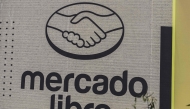 Mercado Libre is displayed on an advertising wall in Mexico City on October 1, 2025. (Photo by Yuri CORTEZ / AFP)