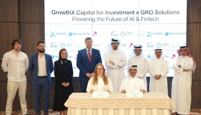 Ambassador of Ukraine to Qatar H E Andrii Kuzmenko and QC Board Member Mohamed bin Ahmed Al Obaidli with other officials witnessing the signing by Chairman of GrowthX Capital Hamad Mubarak Al Hajri and President of Grow Solutions Maria Shevchenko.