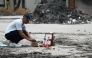 A tribute is set up for Air India Flight 171 plane crash victim Vijay Rupani, former Gujarat chief minister, at the crash site on the first anniversary of the disaster in Ahmedabad on June 12, 2026. Photo by Shammi MEHRA / AFP