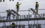 Construction crews build scaffolding outside The Kennedy Center on June 13, 2026 in Washington, DC. Friday marks the court-ordered deadline to remove President Donald trump's name from the Kennedy Center. (Photo by TASOS KATOPODIS / GETTY IMAGES NORTH AMERICA / Getty Images via AFP)