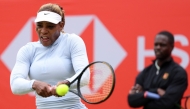 US player Serena Williams hits a shot during a practice session, watched US coach Jarmere Jenkins, at the HSBC WTA tennis Championships at Queen's Club in west London on June 12, 2026.  (Photo by Adrian Dennis / AFP)