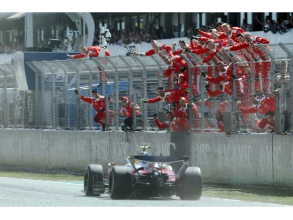 Ferrari team members celebrate Ferrari's British driver Lewis Hamilton's victory in the Catalonia Formula One Grand Prix at the Circuit de Catalunya in Montmelo, on the outskirts of Barcelona, on June 14, 2026. (Photo by Lluis GENE / AFP)