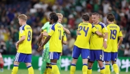 Sweden's players celebrate after winning the 2026 World Cup Group F football match between Sweden and Tunisia at the Monterrey Stadium in Guadalupe on June 14, 2026. (Photo by Julio Cesar Aguilar / AFP)