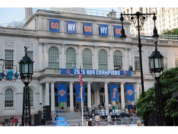 New York Knicks banners adorn the facade of City Hall ahead of the ticker tape victory parade on June 17, 2026 in New York City. Photo by Michael M. Santiago / GETTY IMAGES NORTH AMERICA / Getty Images via AFP