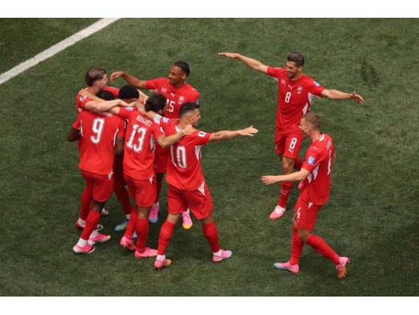 Johan Manzambi #9 of Switzerland celebrates with teammates after scoring the team's third goal during the FIFA World Cup 2026 Group B match between Switzerland and Bosnia and Herzegovina at Los Angeles Stadium on June 18, 2026 in Inglewood, California.