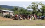 This AFPTV screengrab shows residents affected by Hurricane Melissa on October 29, 2025 receiving humanitarian aid from Caritas volunteers, on June 13, 2026. (Photo by AFPTV STRINGER / AFP)