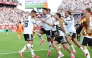 Deniz Undav (left) celebrates with teammates after scoring Germany's second goal.