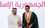 Undersecretary of the Ministry of Awqaf and Islamic Affairs H E Dr. Sheikh Khalid bin Mohammed bin Ghanem Al Thani honouring a graduate at the ceremony.