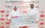 QIIB’s Head of Products Talal al-Jaidah presenting a cheque to the winner Ali Hussain H AL Baker.