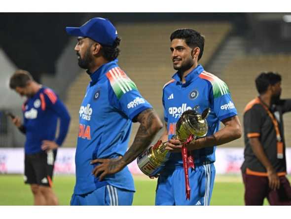 India's captain Shubman Gill holds the series trophy after his team's victory at the end of the third one-day international (ODI) cricket match between India and Afghanistan. (Photo by R. Satish Babu / AFP) 