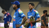 India's captain Shubman Gill holds the series trophy after his team's victory at the end of the third one-day international (ODI) cricket match between India and Afghanistan. (Photo by R. Satish Babu / AFP) 