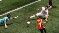 Iran's goalkeeper #01 Alireza Beiranvand makes a save past Belgium's defender #05 Maxim De Cuyper during the 2026 World Cup Group G football match between Belgium and Iran at the Los Angeles Stadium in Inglewood on June 21, 2026. (Photo by Etienne Laurent / AFP)