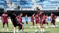 Qatar players participate in a training session.