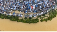 An aerial drone photo taken on June 22, 2026 shows the flood peak passing through the Liujiang River in Liuzhou, south China's Guangxi Zhuang Autonomous Region. (Photo by Li Hanchi/Xinhua)
