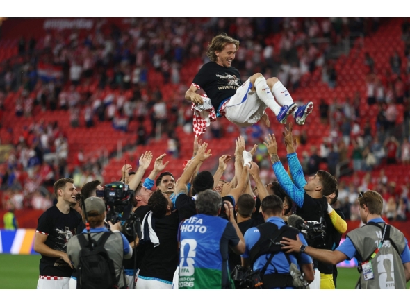 Croatia's midfielder #10 Luka Modric is lifted up by his teammates as they celebrate after winning the 2026 World Cup Group L football match between Panama and Croatia at the Toronto Stadium in Toronto on June 23, 2026. (Photo by Cole Burston / AFP)