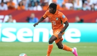 Yan Diomande #11 of Cote d'Ivoire runs with the ball during the FIFA World Cup 2026 Group E match between Germany and Cote D'Ivoire at Toronto Stadium on June 20, 2026 in Toronto, Ontario. (Photo by ALEXANDER HASSENSTEIN / GETTY IMAGES NORTH AMERICA / Getty Images via AFP)