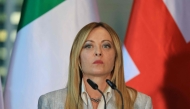 Italy's Prime Minister Giorgia Meloni addresses the press at the end of their meeting of state leaders of the European Group of Five (E5) and the NATO Secretary General, on June 24, 2026 at the Chancellery in Berlin, Germany. (Photo by Ludovic Marin / AFP)
