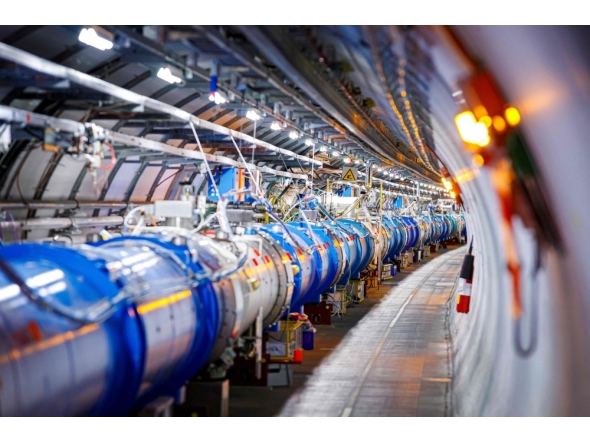 (Files) The 1232 dipole magnets that bend the path of accelerated protons are pictured in the Large Hadron Collider (LHC) in a tunnel of the European Organisation for Nuclear Research (CERN), during maintenance works on February 6, 2020 in Echenevex, France, near Geneva. (Photo by Vlentin Flauraud / AFP)
