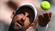 Serbia's Novak Djokovic throws the ball to serve against US player Tommy Paul during their men's singles match on day four of the Giorgio Armani Tennis Classic tournament at the Hurlingham Club in London on June 26, 2026. (Photo by Henry Nicholls / AFP)
