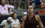 Belarus' Aryna Sabalenka walks back on the tennis court after picking up a new racket from the side as she plays against Jessica Pegula of the US during their women's singles semi-final match at the WTA500 Berlin Tennis Open tournament in Berlin on June 20, 2026. (Photo by John MACDOUGALL / AFP)