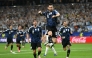 Argentina's forward #10 Lionel Messi celebrates scoring his team's third goal. (Photo by Paul Ellis / AFP)