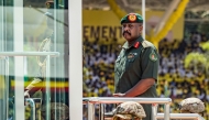 (Files) Muhoozi Kainerugaba (C), son of Yoweri Museveni and Uganda's Chief of Defence Forces, inspects a military parade on May 12, 2026. (Photo by Badru Katumba / AFP)
