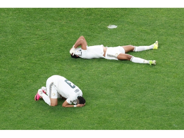 Saudi Arabia's Abdulelah Al-Amri and Ali Lajami react after being eliminated following the 0-0 draw with Cape Verde.