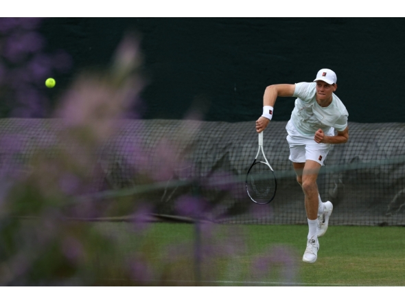 Italy's Jannik Sinner returns to his training partner at the practice courts at The All England Lawn Tennis and Croquet Club in Wimbledon on June 28, 2026. (Photo by Adrian Dennis / AFP)