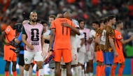 Netherlands' forward #11 Cody Gakpo is consoled by Morocco's defender #03 Noussair Mazraoui after losing the penalty shootout. (Photo by Alfredo Estrella / AFP)
 