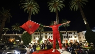 A man waves the Moroccan national flag as football fans celebrate Morocco's victory over the Netherlands in the Round of 32 of the 2026 World Cup, in Rabat early on June 30, 2026. (Photo by Abdel Majid Bziouat / AFP)
 