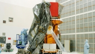This handout photo released by NASA on July 31, 2004, shows the Swift spacecraft being unwrapped in Hangar AE at Cape Canaveral Air Force Station at Kennedy Space Center, Florida. (Photo by Handout / NASA / AFP) 
