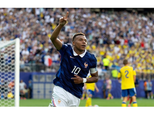 Kylian Mbappe #10 of France celebrates scoring his team's third goal. Al Bello/Getty Images/AFP
