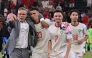Morocco’s head coach Mohamed Ouahbi (left) celebrates with his players after they defeated the Netherlands. (AFP)