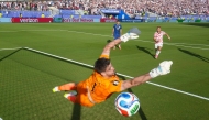 Nikola Vasilj #1 of Bosnia and Herzegovina fails to save a freekick from Malik Tillman #17 of the United States on July 01, 2026 in Santa Clara, California. Charlotte Wilson/Getty Images/AFP