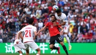 SEATTLE, WASHINGTON - JUNE 26: Mostafa Zico #11 of Egypt competes for a header against Emam Ashour #8 of Egypt during the FIFA World Cup 2026 Group G match between Egypt and IR Iran at Seattle Stadium on June 26, 2026 in Seattle, Washington.  (Photo by Dean Mouhtaropoulos / GETTY IMAGES NORTH AMERICA / Getty Images via AFP)
