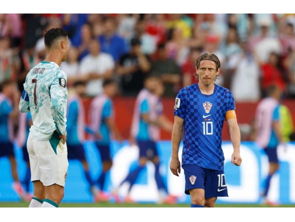 Croatia's midfielder #10 Luka Modric reacts next to Portugal's forward #07 Cristiano Ronaldo on July 2, 2026. (Photo by Kamil Krzaczynski / AFP)