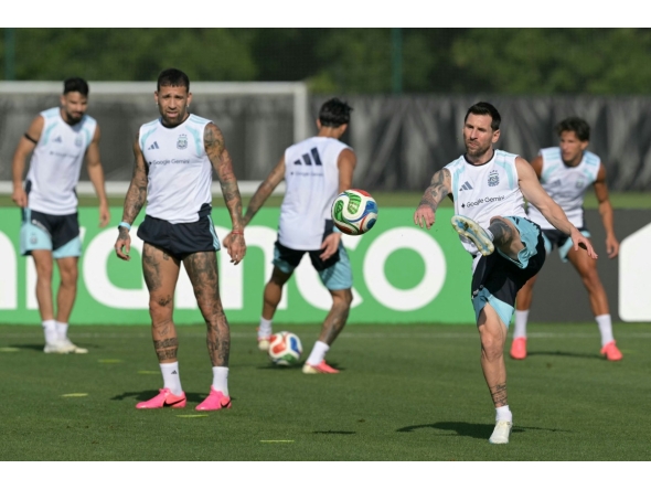 Argentina’s Lionel Messi (right) takes part in a training session with teammates. (AFP)