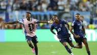 Cape Verde's defender #13 Sidney Lopes Cabral celebrates with teammates scoring his team's second goal during the 2026 World Cup round of 32 football match between Argentina and Cape Verde at the Miami Stadium in Miami Gardens on July 3, 2026. (Photo by PATRICIA DE MELO MOREIRA / AFP)